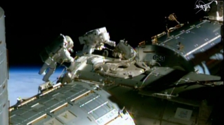 Spacewalking Astronauts Prep Station For Space Taxi Parking Spots